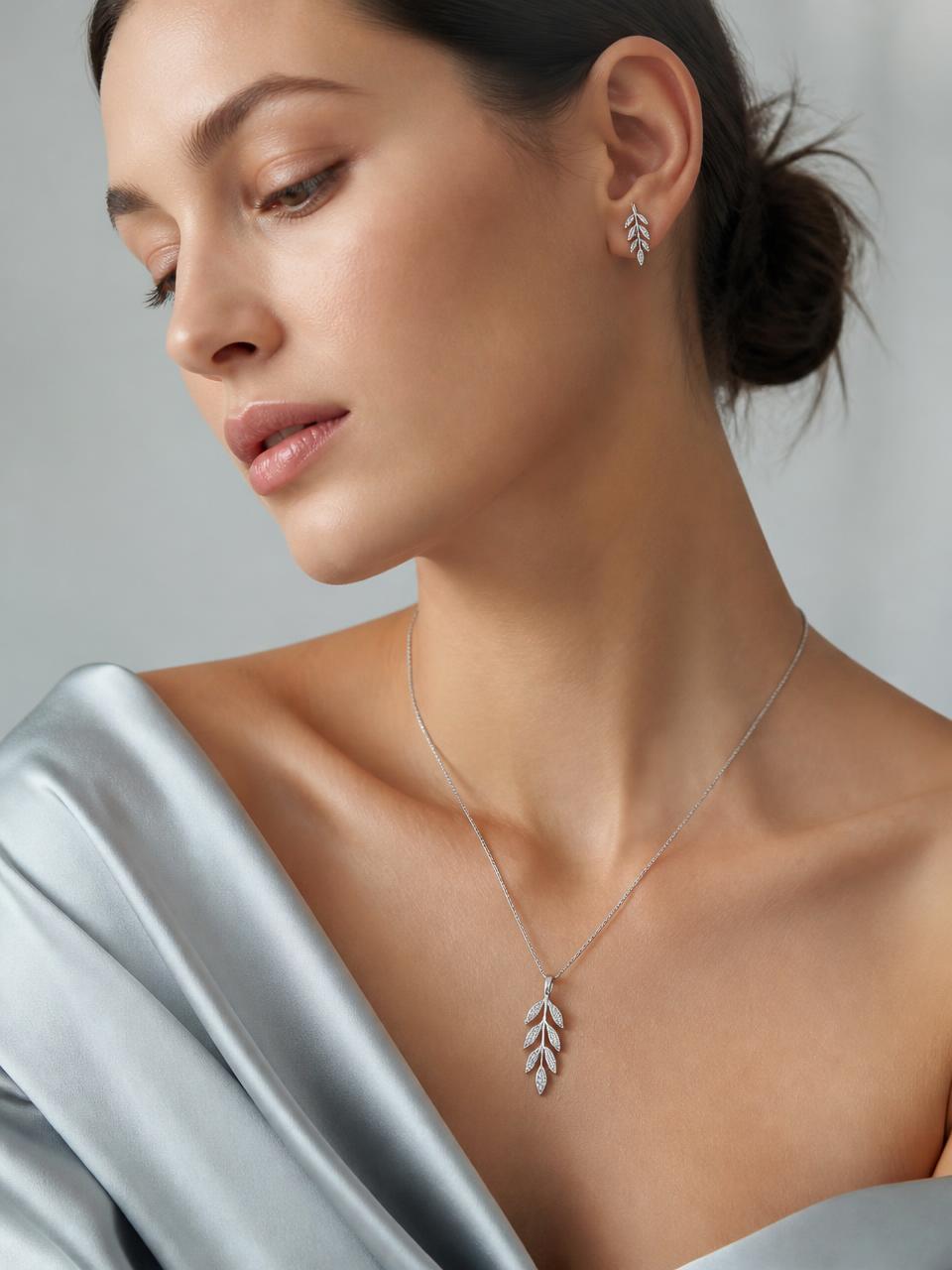 Model wearing a sterling silver leaf pendant